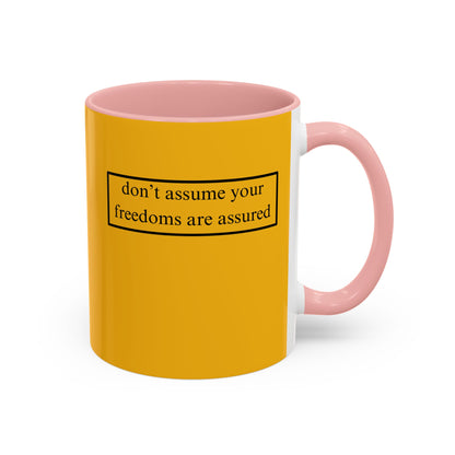 don't assume your freedoms are assured, Black font, Yellow Accent Mug by cypherpunkgear.com