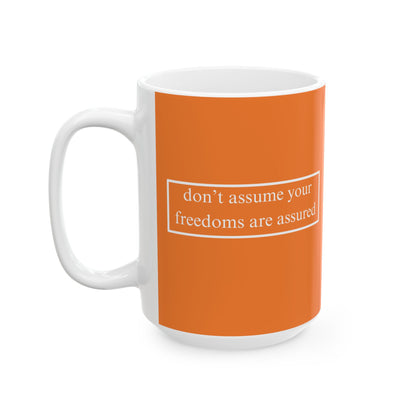 don't assume your freedoms are assured, White font, Orange/White Mug by cypherpunkgear.com