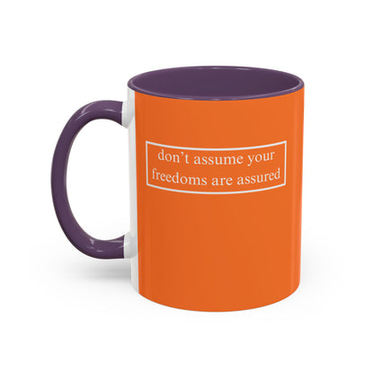 don't assume your freedoms are assured, White font, Orange Accent Mug by cypherpunkgear.com