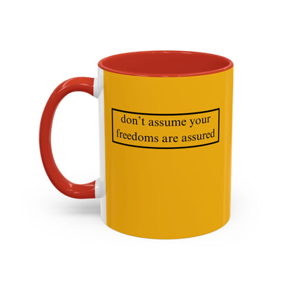 don't assume your freedoms are assured, Black font, Yellow Accent Mug by cypherpunkgear.com