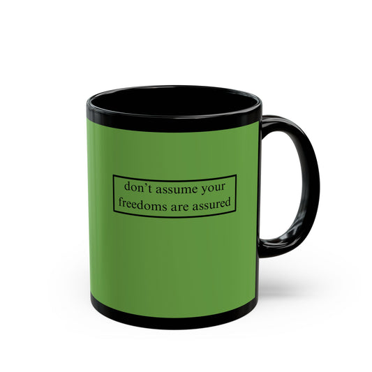 don't assume your freedoms are assured, Black font, Green/Black Mug by cypherpunkgear.com