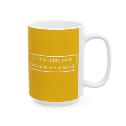 don't assume your freedoms are assured, White font, Yellow/White Mug by cypherpunkgear.com