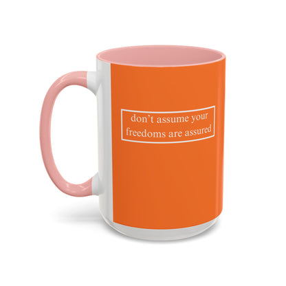 don't assume your freedoms are assured, White font, Orange Accent Mug by cypherpunkgear.com