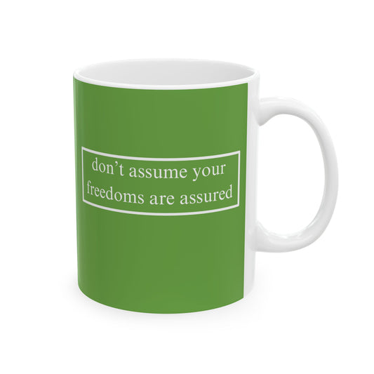 don't assume your freedoms are assured, White font, Green/White Mug by cypherpunkgear.com