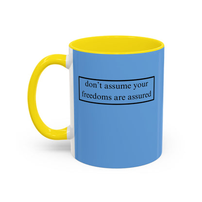 don't assume your freedoms are assured, Black font, Light Blue Accent Mug by cypherpunkgear.com