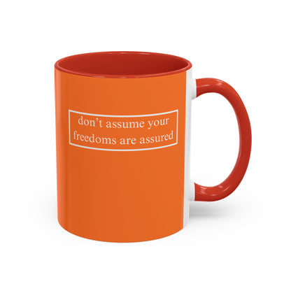 don't assume your freedoms are assured, White font, Orange Accent Mug by cypherpunkgear.com