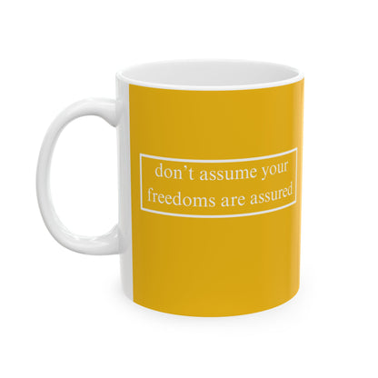 don't assume your freedoms are assured, White font, Yellow/White Mug by cypherpunkgear.com