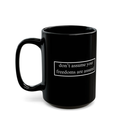 don't assume your freedoms are assured, White font, Black Mug by cypherpunkgear.com