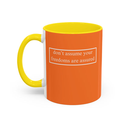 don't assume your freedoms are assured, White font, Orange Accent Mug by cypherpunkgear.com