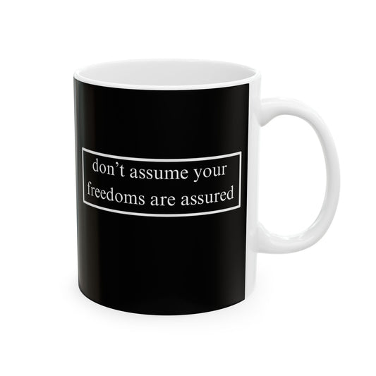 don't assume your freedoms are assured, White font, Black/White Mug by cypherpunkgear.com