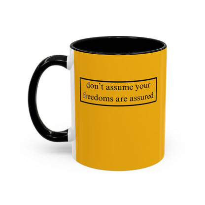 don't assume your freedoms are assured, Black font, Yellow Accent Mug by cypherpunkgear.com