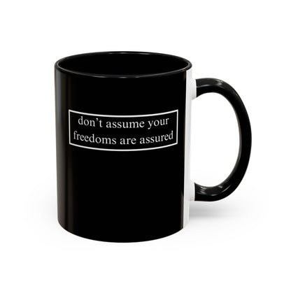 don't assume your freedoms are assured, White font, Black Accent Mug by cypherpunkgear.com