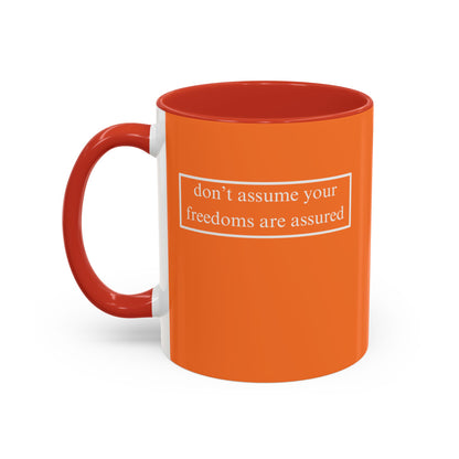 don't assume your freedoms are assured, White font, Orange Accent Mug by cypherpunkgear.com