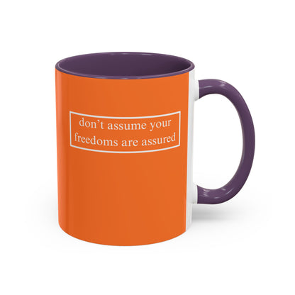 don't assume your freedoms are assured, White font, Orange Accent Mug by cypherpunkgear.com