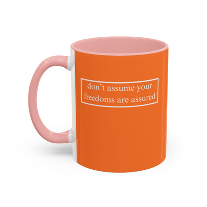 don't assume your freedoms are assured, White font, Orange Accent Mug by cypherpunkgear.com