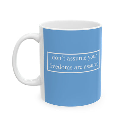 don't assume your freedoms are assured, White font, Light Blue/White Mug by cypherpunkgear.com