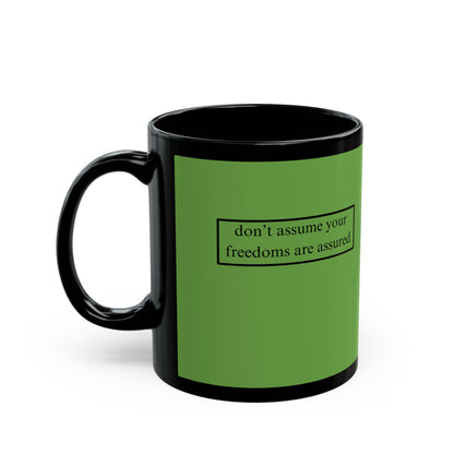 don't assume your freedoms are assured, Black font, Green/Black Mug by cypherpunkgear.com