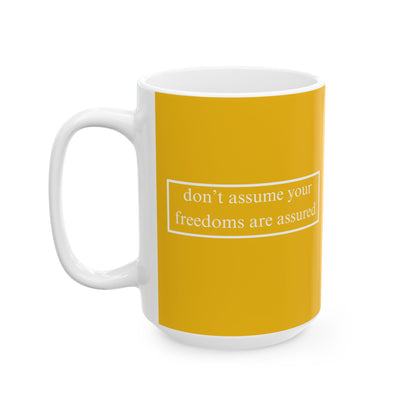don't assume your freedoms are assured, White font, Yellow/White Mug by cypherpunkgear.com