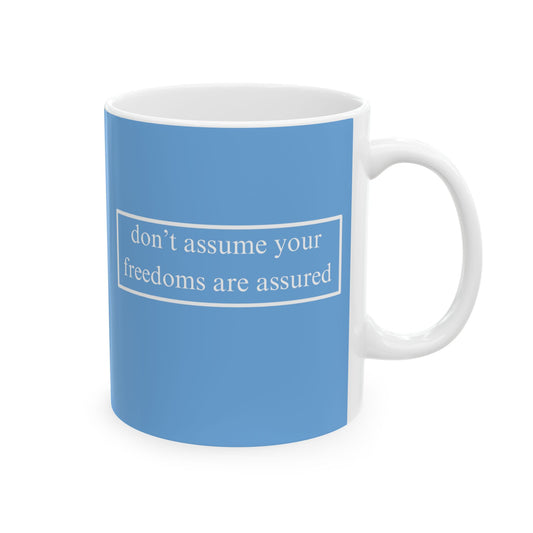 don't assume your freedoms are assured, White font, Light Blue/White Mug by cypherpunkgear.com